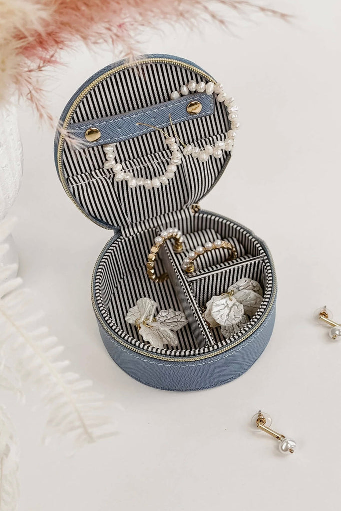 Sisco jewellery box - cloudy blue-Louenhide-The Louenhide Sisco Cloudy Blue Jewellery box is a gorgeous travel case ideal for storing your precious gems. Organise your essential items easily with three ring rolls, two compartments, an elasticated slip pocket and a press stud tab for earrings. Structured and protected, this affordable jewellery case will be your new travel companion. Internal Features 3 Ring Rolls, Press Stud Earring Band, Elastic Slip Pocket, 2 Compartments Internal Lining Polyester Recycle