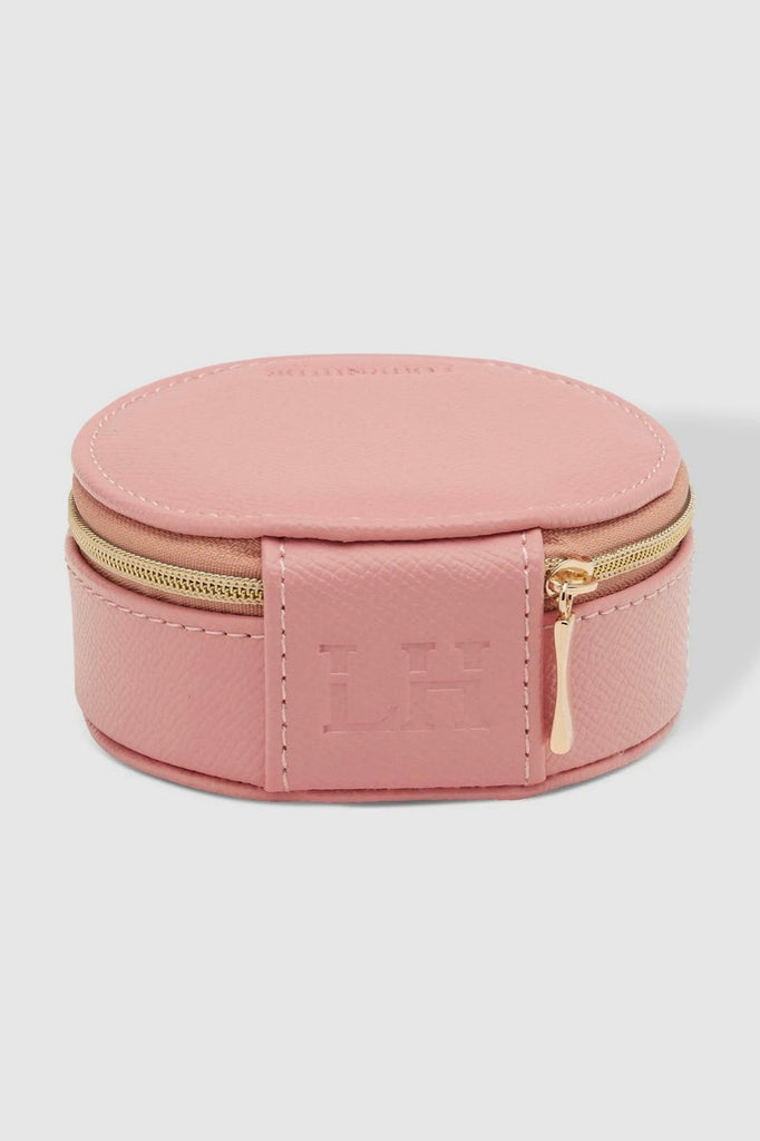 Sisco jewellery box - pink-Louenhide-The Louenhide Sisco Pink Jewellery box is a gorgeous travel case ideal for storing your precious gems. Organise your essential items easily with three ring rolls, two compartments, an elasticated slip pocket and a press stud tab for earrings. Structured and protected, this affordable jewellery case will be your new travel companion. Internal Features 3 Ring Rolls, Press Stud Earring Band, Elastic Slip Pocket, 2 Compartments Internal Lining Faux Suede Pink 100% Lining Clo