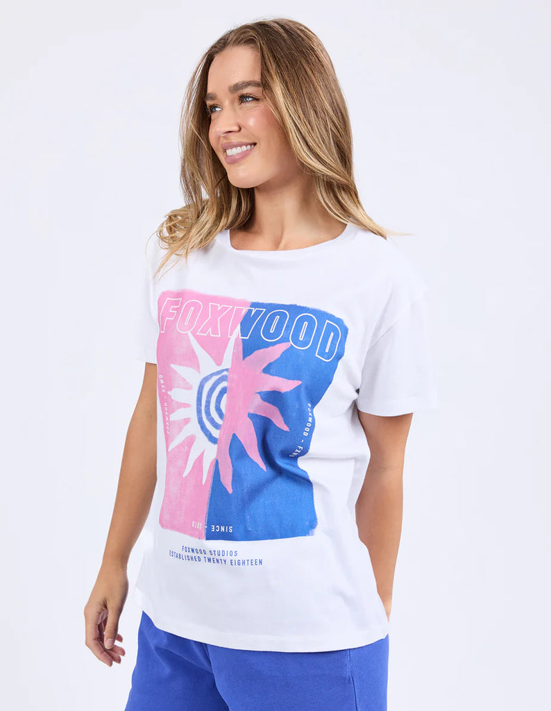 Solar Tee - White-Foxwood-Turn up the colour in this bold oversized tee. Featuring a bright exclusive print, classic round neckline, and a relaxed oversized fit, it’s made for easy days with maximum style. Just throw it on and go loud. Foxwood exclusive front chest print Round neckline Oversized fit 100% Cotton Model is wearing a size 10-Pash + Evolve