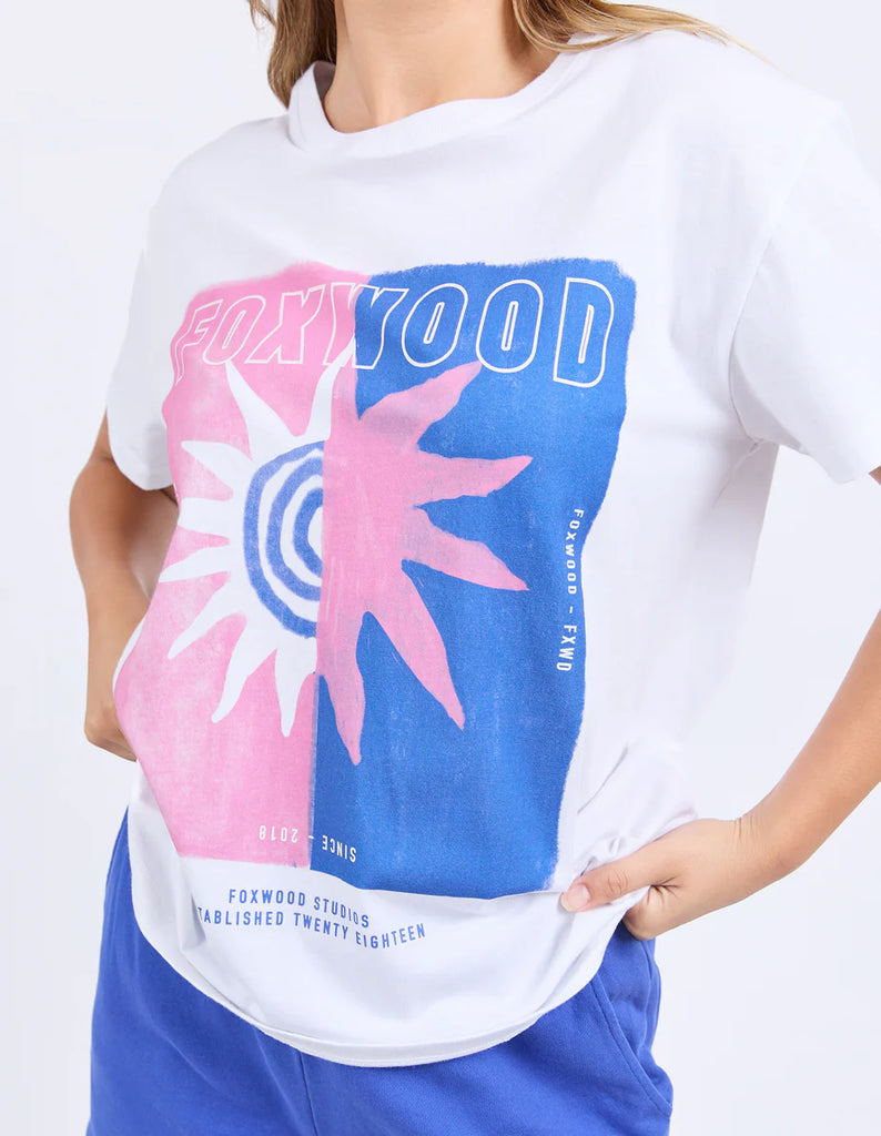 Solar Tee - White-Foxwood-Turn up the colour in this bold oversized tee. Featuring a bright exclusive print, classic round neckline, and a relaxed oversized fit, it’s made for easy days with maximum style. Just throw it on and go loud. Foxwood exclusive front chest print Round neckline Oversized fit 100% Cotton Model is wearing a size 10-Pash + Evolve