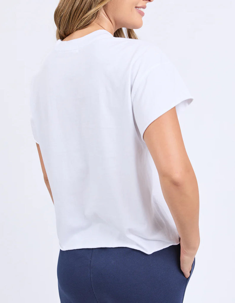 Stamp Tee - White-Foxwood-Give your look a twist with the Stamp Tee. Featuring raw edge detailing that’s all about laid-back cool. It’s the perfect little rough-around-the-edges touch that adds personality and keeps things fresh. Front chest embroidery Round neckline Raw edge detail 100% Cotton Model is wearing a size 10-Pash + Evolve