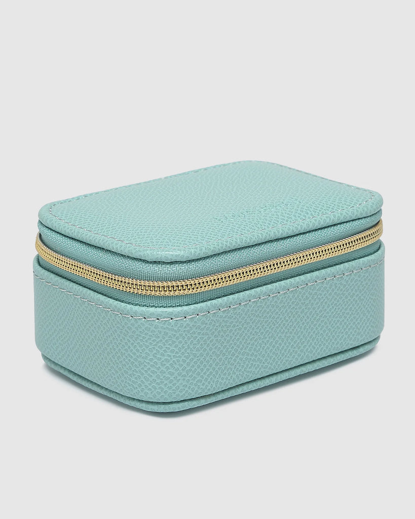 Suzie Jewellery Box - Mint-Louenhide-The Louenhide Suzie Mint Jewellery Box is a sweet travel companion ready to store all of your rings, necklaces, bracelets, and earrings. Use every day and stow in your bag for on-the-go use, or pack for weekend adventures. Featuring three ring rolls, two compartments, and an elasticated slip pocket, your precious gems will be secured safely. Internal Features 2 Ring Rolls, Elastic Slip Pocket, 2 Compartments Internal Lining Faux Suede 100% Lining Closure Secure Zip Body
