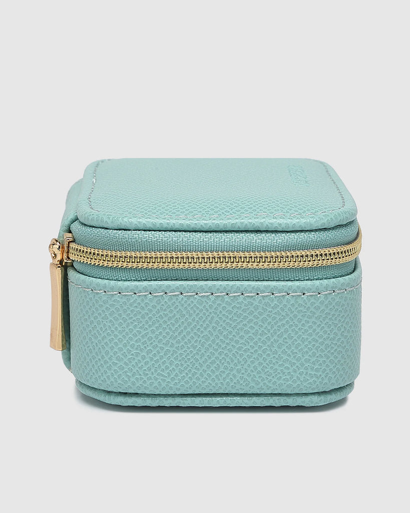 Suzie Jewellery Box - Mint-Louenhide-The Louenhide Suzie Mint Jewellery Box is a sweet travel companion ready to store all of your rings, necklaces, bracelets, and earrings. Use every day and stow in your bag for on-the-go use, or pack for weekend adventures. Featuring three ring rolls, two compartments, and an elasticated slip pocket, your precious gems will be secured safely. Internal Features 2 Ring Rolls, Elastic Slip Pocket, 2 Compartments Internal Lining Faux Suede 100% Lining Closure Secure Zip Body