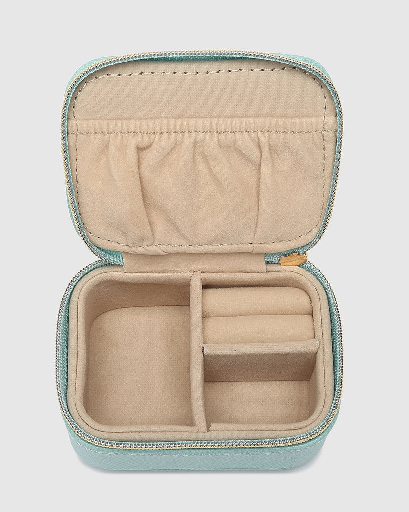 Suzie Jewellery Box - Mint-Louenhide-The Louenhide Suzie Mint Jewellery Box is a sweet travel companion ready to store all of your rings, necklaces, bracelets, and earrings. Use every day and stow in your bag for on-the-go use, or pack for weekend adventures. Featuring three ring rolls, two compartments, and an elasticated slip pocket, your precious gems will be secured safely. Internal Features 2 Ring Rolls, Elastic Slip Pocket, 2 Compartments Internal Lining Faux Suede 100% Lining Closure Secure Zip Body