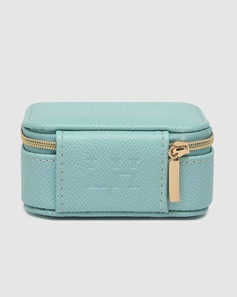 Suzie Jewellery Box - Mint-Louenhide-The Louenhide Suzie Mint Jewellery Box is a sweet travel companion ready to store all of your rings, necklaces, bracelets, and earrings. Use every day and stow in your bag for on-the-go use, or pack for weekend adventures. Featuring three ring rolls, two compartments, and an elasticated slip pocket, your precious gems will be secured safely. Internal Features 2 Ring Rolls, Elastic Slip Pocket, 2 Compartments Internal Lining Faux Suede 100% Lining Closure Secure Zip Body