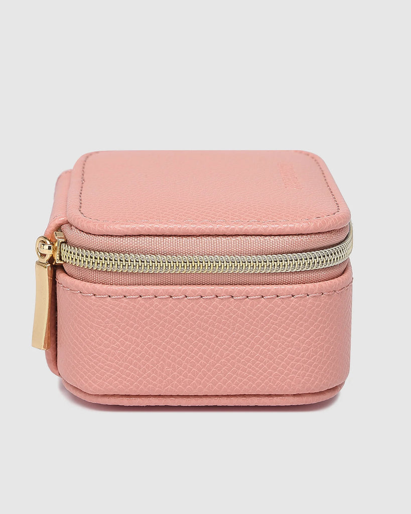 Suzie jewellery box - pink-Louenhide-The Louenhide Suzie Pink Jewellery Box is a sweet travel companion ready to store all of your rings, necklaces, bracelets, and earrings. Use every day and stow in your bag for on-the-go use, or pack for weekend adventures. Featuring three ring rolls, two compartments, and an elasticated slip pocket, your precious gems will be secured safely. Internal Features 2 Ring Rolls, Elastic Slip Pocket, 2 Compartments Internal Lining Faux Suede 100% Lining Closure Secure Zip Body
