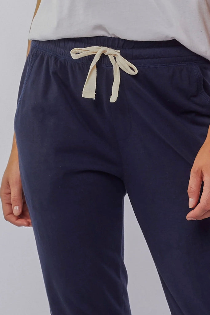 Wash out lounge pant - navy-Elm-Everybody's Favourite, The Elm Wash Out Pant Is Made In A 100% Cotton Soft Jersey Fabric And Features Deep Side Pockets And An Elastic Waist For Effortless Everyday Wear. The Dressy Trackie Thick Waistband with Cloth Drawstring Tapered Bottom Leg 100% Cotton Model is 169cm and wears Size 10-Pash + Evolve