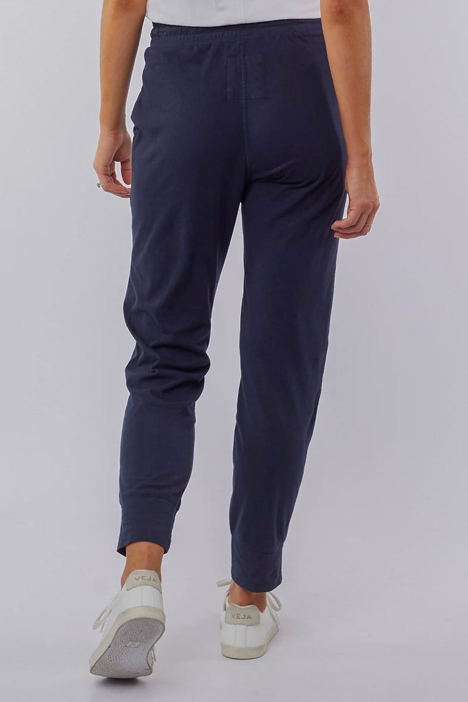 Wash out lounge pant - navy-Elm-Everybody's Favourite, The Elm Wash Out Pant Is Made In A 100% Cotton Soft Jersey Fabric And Features Deep Side Pockets And An Elastic Waist For Effortless Everyday Wear. The Dressy Trackie Thick Waistband with Cloth Drawstring Tapered Bottom Leg 100% Cotton Model is 169cm and wears Size 10-Pash + Evolve