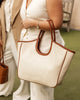 Alexandra Tote Bag - Canvas/Tan-Louenhide-The Alexandra Canvas Tan Tote Bag is a modern essential, thoughtfully designed to carry you from workdays to weekends with ease. This spacious everyday carryall bag balances elevated style and everyday function, making it the perfect lightweight work tote for women that also doubles as your weekend market companion. The tan vegan leather complements the neutral canvas, offering a balanced aesthetic suitable for both casual outings and formal settings. Designed with 