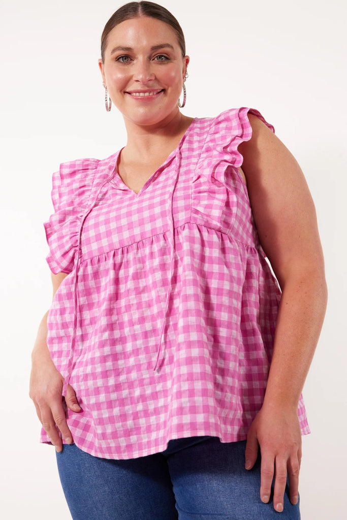 Alfresco frill top - carnival-Isle of Mine-Capture the essence of summer in the Alfresco Frill Top, crafted from a lightweight linen blend. This playful gingham print style features a selection of vibrant summer colours perfect for any occasion. With stylish frilled sleeves, a v-neck with a self-tie, and a breezy hem, pair it with linen shorts and sandals for a relaxed weekend look. FEATURES: V-neck with self-tie Frilled sleeves Single tier with gathering Relaxed hem 38% Linen, 35% Polyester, 27% Cotton-Pas