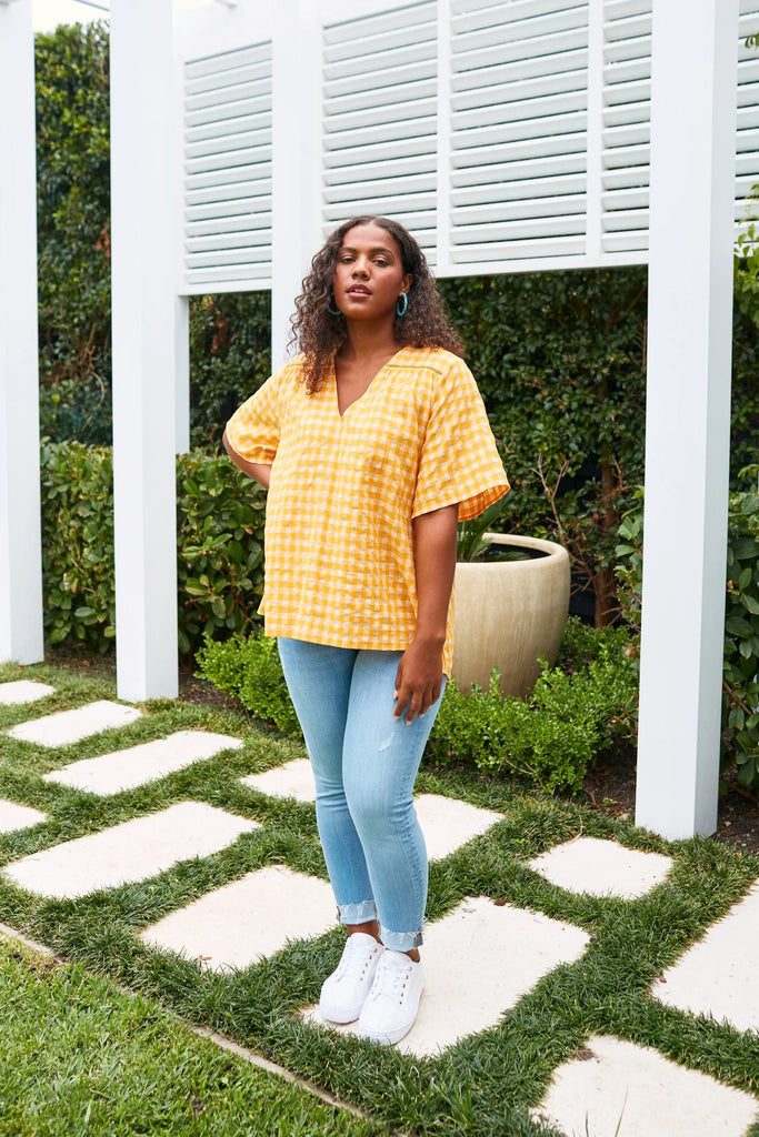 Alfresco top - sunrise-Isle of Mine-The Alfresco Top will become a staple of your summer wardrobe, crafted from a breathable linen blend. The one-size fit, V-neck, and elbow-length sleeves ensure maximum airflow for a cool summer feel. The vibrant summer palette and playful gingham print make it perfect for all-season wear. Pair this effortless top with linen shorts and sneakers for an easy, everyday look. FEATURES: V-neck Elbow-length sleeves Ladder lace detail High-low hem Relaxed fit 38% Linen, 35% Polye