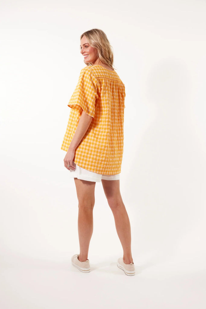 Alfresco top - sunrise-Isle of Mine-The Alfresco Top will become a staple of your summer wardrobe, crafted from a breathable linen blend. The one-size fit, V-neck, and elbow-length sleeves ensure maximum airflow for a cool summer feel. The vibrant summer palette and playful gingham print make it perfect for all-season wear. Pair this effortless top with linen shorts and sneakers for an easy, everyday look. FEATURES: V-neck Elbow-length sleeves Ladder lace detail High-low hem Relaxed fit 38% Linen, 35% Polye