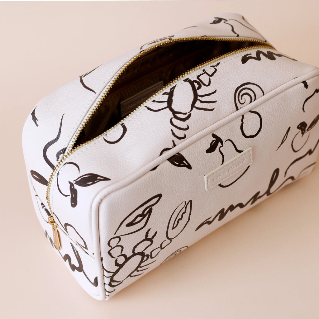 Amalfi wash bag-Fox & Fallow-The bag of your dreams is here! With so many bonus features, you’ll be wondering where they’ve been all your life. Beautiful, but practical. Perfect as an everyday make up bag or for all your bathroom essentials for the next work trip or vacay. Crafted from super soft, yet durable luxury pebble vegan leather it's easy to keep clean - simply wipe down with a damp cloth. The monogrammed tan lining is designed to hide make up or spills but also makes it easy to find all your thing