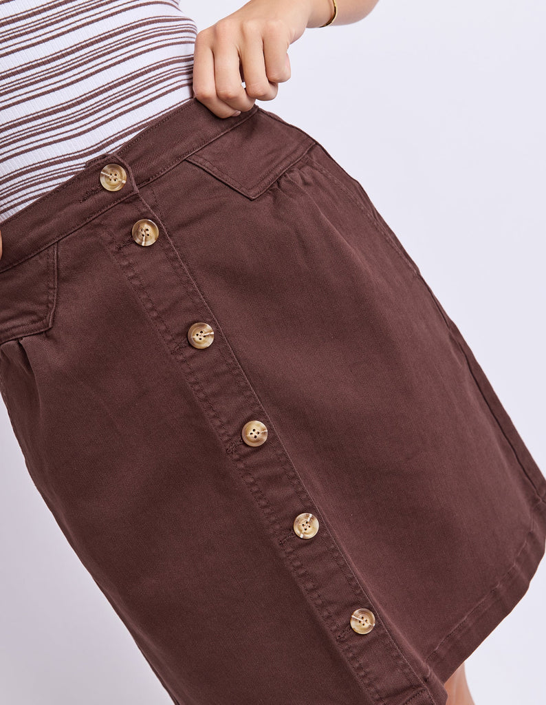 Amanda skirt - chocolate-Foxwood-A little bit retro. A lot of cute. This A-Line denim button front skirt is a must-have this season. Featuring side pockets, front tuck detail and an elasticated back, this skirt looks great with strappy sandals and your favourite tee! Flat front and elastic back waist Front button opening Side pockets 99% Cotton, 1% Elastane Our model is 176cm and wears Size 10-Pash + Evolve