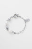 Amara bracelet - silver-Zarla-A refined bracelet combining soft pearls with elongated, textured links. Light-catching and softly layered, it brings a cool, luminous feel to your wrist. Feminine, elevated, and designed for everyday wear. *Rhodium Plated Solid Brass Base *Water proof: Can be worn in the ocean or pool-Pash + Evolve