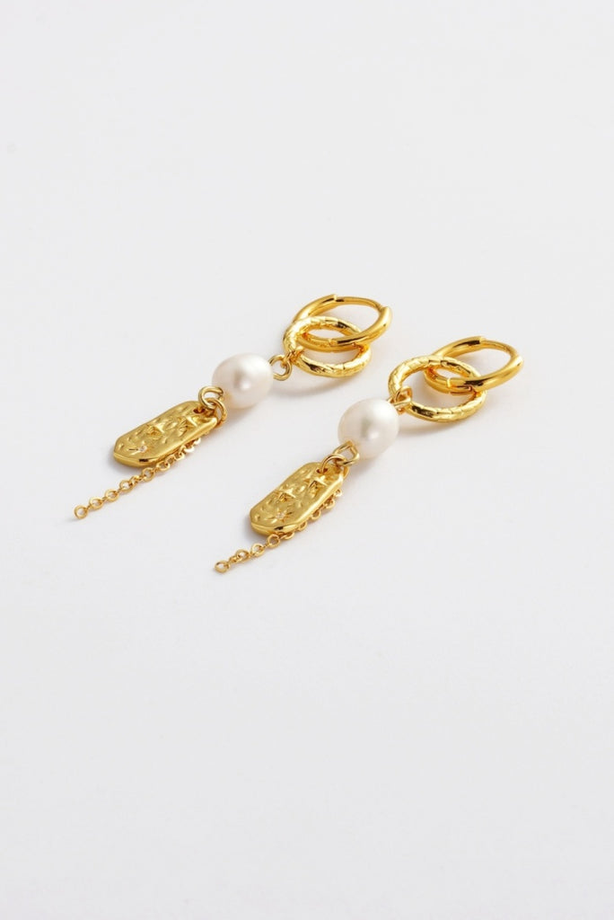 Amara drop earring - gold-Zarla-A layered drop earring combining sculptural links, soft pearls, and textured detailing. Light-catching and fluid, it brings a warm, sunlit feel with an effortless, coastal edge. Feminine, elevated, and designed to stand out with ease. *18K Gold Plated Solid Brass Base *Water proof: Can be worn in the ocean or pool-Pash + Evolve