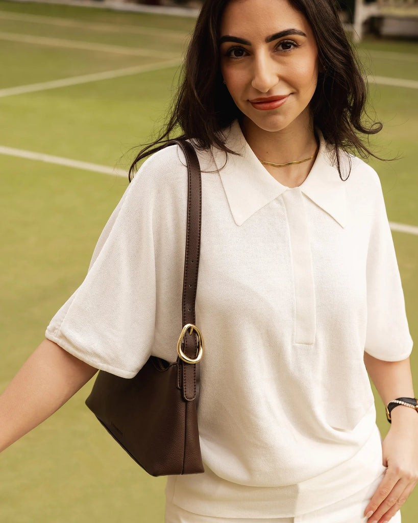 Amelia Shoulder Bag - Chocolate-Louenhide-The Amelia Chocolate Shoulder Bag is a striking addition to your collection of minimalist handbags, defined by clean lines and a distinctive, asymmetrical structured silhouette. With elevated detailing and a modern edge, Amelia offers a fresh perspective on everyday styling. Finished in smooth chocolate vegan leather and elevated with gold hardware, she adds instant polish to any look. The adjustable shoulder strap allows for a comfortable, customised fit, while the