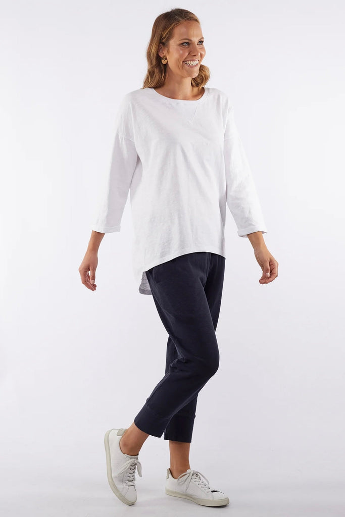 Annie 3/4 Sleeve - White-Elm-A Favourite For All Seasons. The 100% Cotton Slub Jersey Annie Tee Features ¾ Sleeves And A Scooped Back Hemline Making It Ideal For Layering. The Cuffs Have A Cute Roll And The Drop Shoulders Make It Comfort + For Everyday Wear. Relaxed Fit 3/4 Length Sleeves with Rolled Cuff Scooped Hemline 100% Cotton Jersey Model is 169cm and wears Size 10-Pash + Evolve