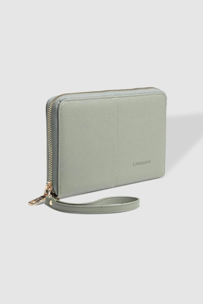 Arabella Travel Wallet - Sage Green-Louenhide-The Louenhide Arabella Sage Green Travel Wallet is a luxe, soft carryall wallet that is perfect for any adventure. Embark on your journeys with confidence, knowing that all your travel essentials are neatly organised and easily accessible. With thoughtfully designed compartments, our travel wallet effortlessly accommodates your passport, ID, boarding passes, and other essential documents. Everything you need is right at your fingertips. Prepare for seamless and 