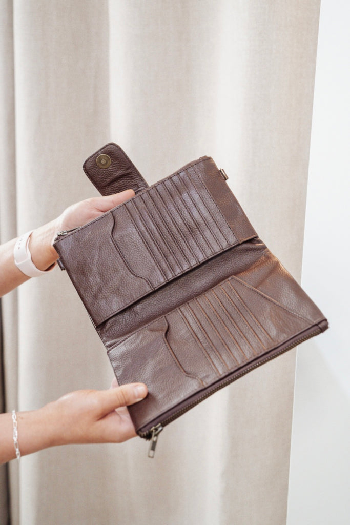 Arlo travel wallet - chocolate pebble-Baleka Leather-Designed for the modern traveller, the Arlo Travel Wallet blends sleek style with smart functionality. Crafted for convenience, it features a press-stud closure for quick access and dual zip compartments to keep your essentials securely organized. The Arlo wallet includes an attachable strap, allowing you to wear it comfortably across the body — perfect for on-the-go adventures or everyday errands Whether you’re boarding a flight or exploring a new city, 