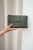 Arlo travel wallet - olive green pebble-Baleka Leather-Designed for the modern traveller, the Arlo Travel Wallet blends sleek style with smart functionality. Crafted for convenience, it features a press-stud closure for quick access and dual zip compartments to keep your essentials securely organized. The Arlo wallet includes an attachable strap, allowing you to wear it comfortably across the body — perfect for on-the-go adventures or everyday errands Whether you’re boarding a flight or exploring a new city