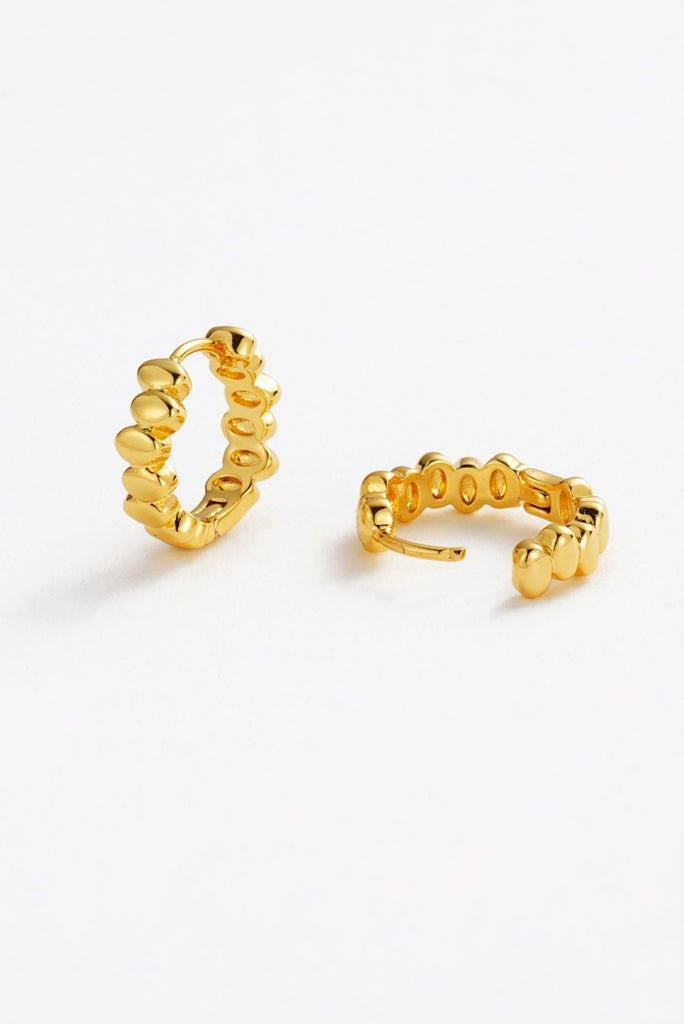 Bailey huggie - gold-Zafino-The Bailey Huggie is a sleek, plain metal hoop designed for effortless everyday wear. With its minimalist style and comfortable fit, it’s the perfect go-to piece for stacking or wearing on its own for a clean, polished look. *18K Gold Plated Solid Brass Base *18K Gold Plat-Pash + Evolve