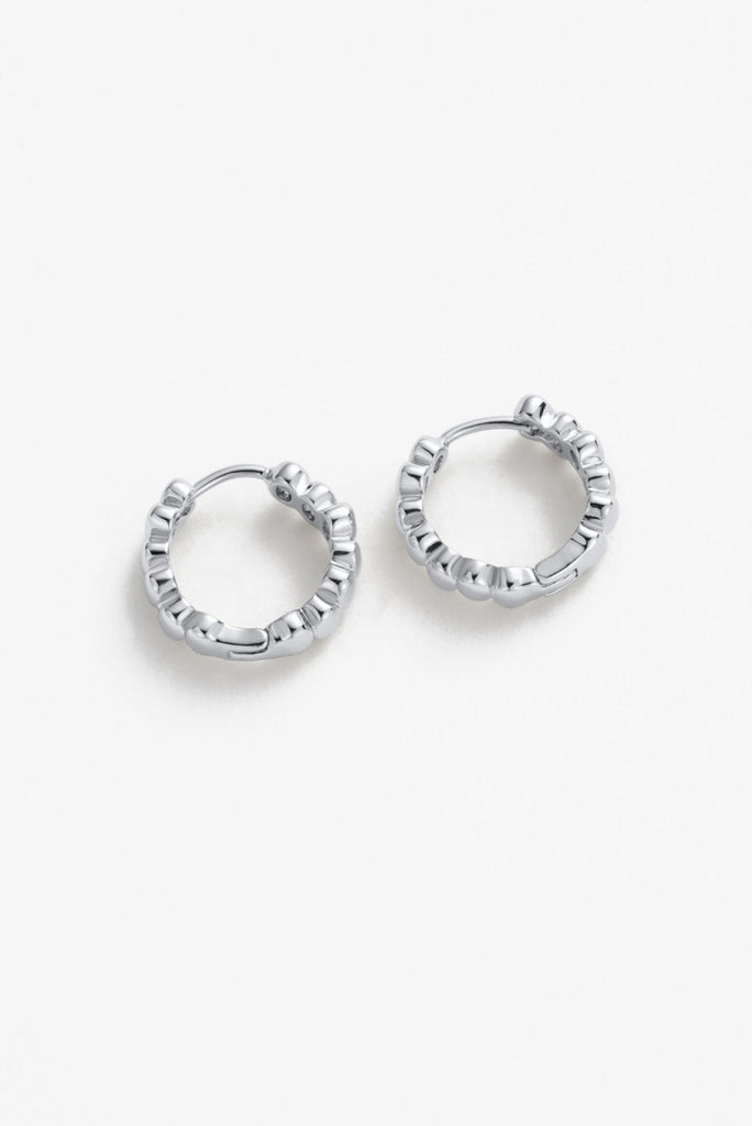 Bailey huggie - silver-Zafino-The Bailey Huggie is a sleek, plain metal hoop designed for effortless everyday wear. With its minimalist style and comfortable fit, it’s the perfect go-to piece for stacking or wearing on its own for a clean, polished look *Silver Plated Solid Brass Base *Splash Proof: Splashes or occasional water contact *4mm (w) x 12mm (L)-Pash + Evolve