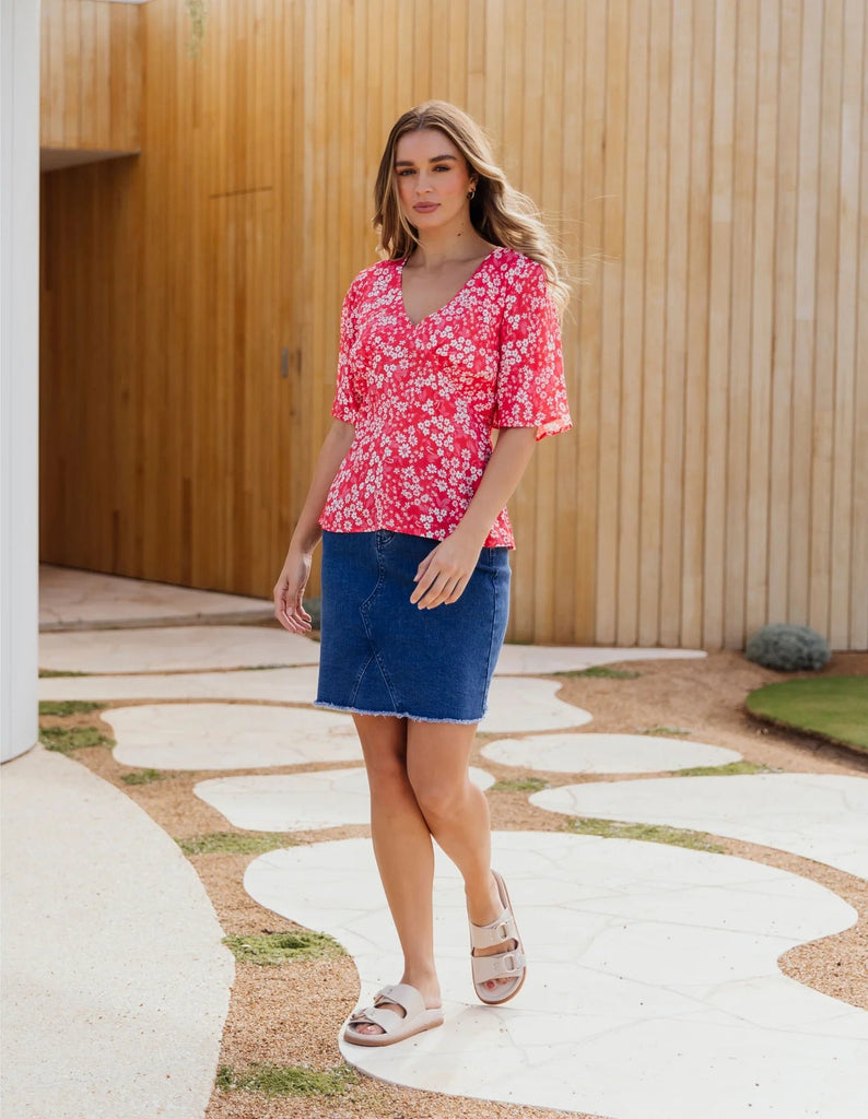 Belle Skirt - Mid Blue-Foxwood-Your new favourite A-line skirt, flaunting a raw edge hem and the relaxed fit of stretch denim, this one will have you sorted for the season. Front Button Opening Knee length Slim fit Stretch Denim Our model is 176cm and wears Size 10-Pash + Evolve