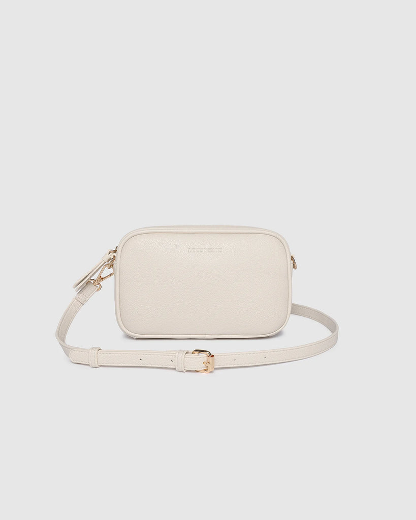 Bianca Crossbody Bag - Vanilla-Louenhide-The Bianca Vanilla Crossbody Bag is a stylish yet practical companion, thoughtfully crafted for life on the move. This women’s crossbody bag features a compact, camera-style silhouette that combines everyday functionality with timeless appeal. Made from buttery soft vegan leather and finished with light gold hardware, Bianca Vanilla brings a polished touch to casual styling. As a travel-friendly crossbody, she’s lightweight and easy to wear, with two interchangeable 