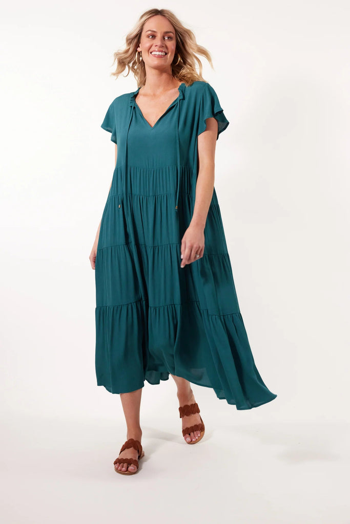 Botanical tiered dress - teal-Isle of Mine-Embrace a carefree summer with the Botanical Tiered Dress. Its flowing silhouette and luxurious silk-like fabric make it an excellent choice for day-to-day wear. Whether you pair it with sneakers or sandals, this dress offers effortless style and is perfect for a relaxed coffee meet-up with friends. FEATURES: Frilled V-neck with drawstring Short flutter sleeves Tiered with gathering Inseam pockets Maxi-length Plain Material: 100% Viscose Print Material: 100% Rayon-