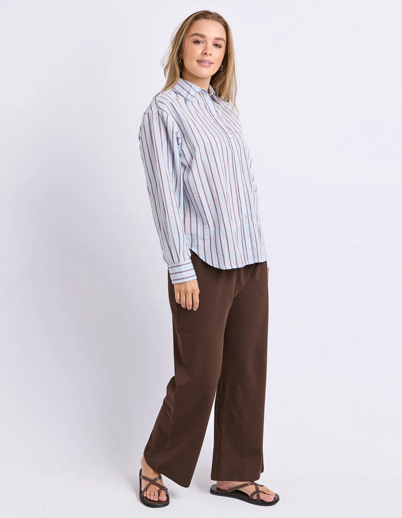 Breeze Shirt - Light Blue-Foxwood-Classic stripes with a relaxed feel. The Breeze Shirt is crafted from breathable cotton with yarn dyed stripes and an easy oversized silhouette. Finished with a front chest pocket and button through design, it's the kind of shirt you'll throw on over denim, shorts or wear open as a lightweight layer all season long. Yarn dyed stripe Front chest pocket Relaxed fit Model is wearing a size 10-Pash + Evolve