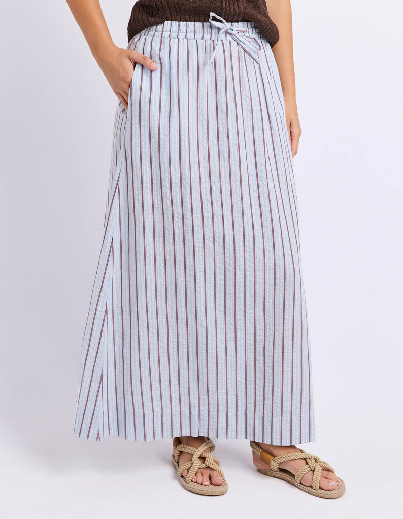 Breeze Skirt - Light Blue-Foxwood-Made for sunny days and slow weekends. The Breeze Skirt is crafted from breathable cotton with yarn dyed stripes and an easy flowing silhouette. Finished with an elastic waistband, adjustable drawcord and side pockets, it's the kind of skirt you'll keep reaching for all season long. Elastic waist with drawcord Yarn dyed stripe Side pockets Model is wearing a size 10-Pash + Evolve