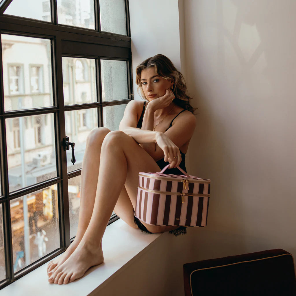 Burgundy Stripe - Vanity Case-Fox & Fallow-Say hello to your new bestie - the Fox & Fallow 'Classic' Vanity Case! She’ll get you organised and keep you organised, whipping your skincare and makeup routine into shape. Not just for travel, it's the perfect bag for everyday! • Vanity Case: 24 x 16.5 x 17.5cm.• Box: 26 x 20 x 20cm.• Pebble vegan leather with a tan lining.• Dual layer with elastic loops.• Internal zip pocket.• Gold hardware.• Two handles and two zippers for easy access.• Bonus removable clear ba
