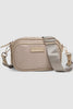 Cali Nylon Crossbody Bag - Beige-Louenhide-The Louenhide Cali Beige Nylon Crossbody Bag is designed for comfort and convenience. The adjustable and detachable sateen guitar strap allows for comfortable wear crossbody or over the shoulder. The bag features one zip pocket and one slip pocket in the main compartment, as well as a front zip pocket for easy access to essentials. The secure zip closure keeps your belongings safe and secure. The light gold hardware adds a touch of elegance to this practical and st