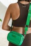Cali nylon crossbody bag - apple green-Louenhide-The Louenhide Cali Apple Green Nylon Crossbody Bag is designed for comfort and convenience. The adjustable and detachable sateen guitar strap allows for comfortable wear crossbody or over the shoulder. The bag features one zip pocket and one slip pocket in the main compartment, as well as a front zip pocket for easy access to essentials. The secure zip closure keeps your belongings safe and secure. The light gold hardware adds a touch of elegance to this prac