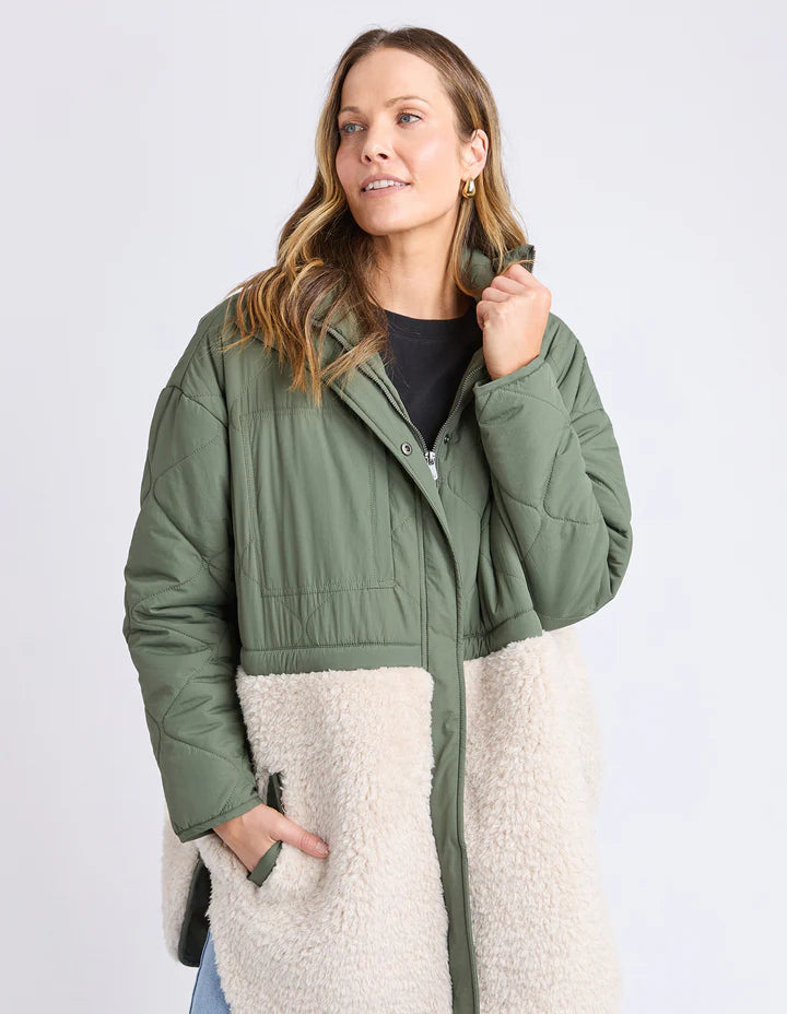 Celia Coat - Khaki-Foxwood-Make the most of mixing materials with this half nylon shell, half sherpa Celia Coat. There's something extra special about the warmth of the intense black hue contrasted with the warmth of the natural sherpa. Great coat for cooler days that features a zip front, buttons & pockets. Contrast teddy fur panel Front zip opening Longline fit TOP: 100% Nylon BOTTOM: 100% Polyester LINING: 100% Polyester Model is 176cm and wears size 10-Pash + Evolve