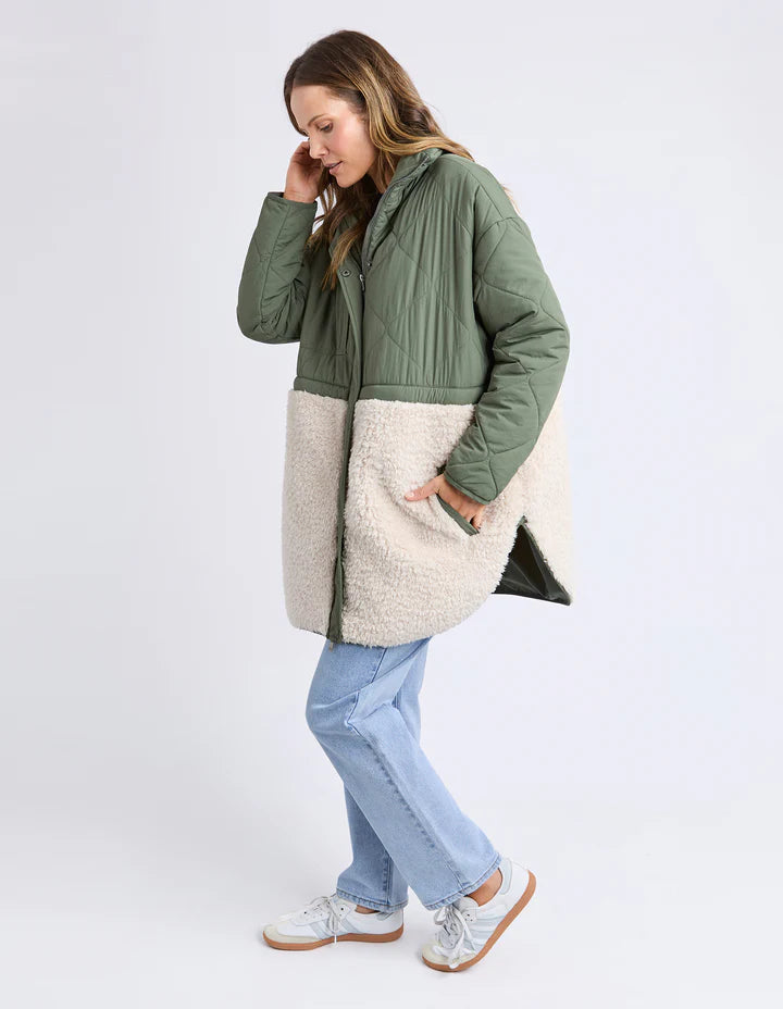 Celia Coat - Khaki-Foxwood-Make the most of mixing materials with this half nylon shell, half sherpa Celia Coat. There's something extra special about the warmth of the intense black hue contrasted with the warmth of the natural sherpa. Great coat for cooler days that features a zip front, buttons & pockets. Contrast teddy fur panel Front zip opening Longline fit TOP: 100% Nylon BOTTOM: 100% Polyester LINING: 100% Polyester Model is 176cm and wears size 10-Pash + Evolve