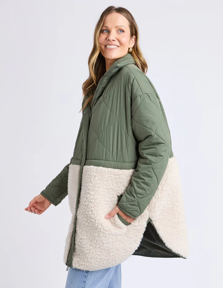 Celia Coat - Khaki-Foxwood-Make the most of mixing materials with this half nylon shell, half sherpa Celia Coat. There's something extra special about the warmth of the intense black hue contrasted with the warmth of the natural sherpa. Great coat for cooler days that features a zip front, buttons & pockets. Contrast teddy fur panel Front zip opening Longline fit TOP: 100% Nylon BOTTOM: 100% Polyester LINING: 100% Polyester Model is 176cm and wears size 10-Pash + Evolve