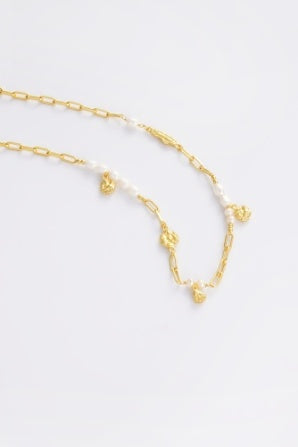 Charlotte Necklace - Pearl-Zarla-A refined chain detailed with soft pearls and delicate, shell-inspired charms. Light-catching and layered, it brings an effortless, ocean-inspired feel to your look. Feminine, elevated, and designed for easy everyday wear. *18K Gold Plated Solid Brass Base. *42cm + 5cm Extender *This piece is handmade and not recommended to be worn in water-Pash + Evolve