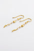 Charlotte Thread Earring - Pearl-Zarla-A delicate thread earring adorned with soft pearls and sculpted accents. Light and fluid in design, it moves effortlessly with you, catching the light with a subtle, sunlit glow. Feminine, refined, and perfect for elevating everyday wear. *18K Gold Plated Solid Brass Base *This piece is handmade and not recommended to be worn in water-Pash + Evolve