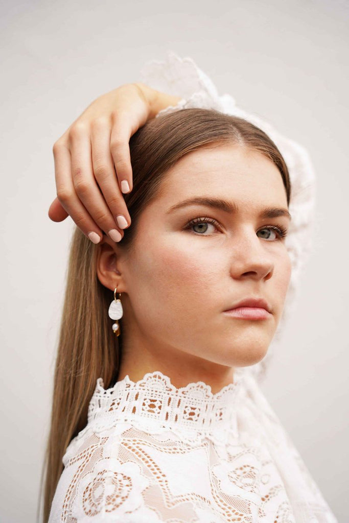 Chloe earrings - pearl-Hagen + Co-An organic shaped earring in marbled, pearl acrylic with charms in amber tubed coloured glass beads and freshwater pearl nuggets. Hanging from a gold huggie hoop. These earrings are so delicate and pretty with a contemporary edge. One of our favourites!*Materials: Acrylic, glass beads, freshwater pearls*Nickel Free earring hoops*Light weight and easy to wear.*Hoop: 15mm*Earring: 13mm x 40mm*Packaged in a gift box-Pash + Evolve