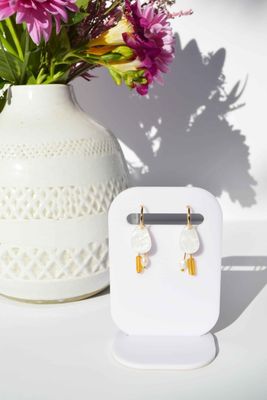 Chloe earrings - pearl-Hagen + Co-An organic shaped earring in marbled, pearl acrylic with charms in amber tubed coloured glass beads and freshwater pearl nuggets. Hanging from a gold huggie hoop. These earrings are so delicate and pretty with a contemporary edge. One of our favourites!*Materials: Acrylic, glass beads, freshwater pearls*Nickel Free earring hoops*Light weight and easy to wear.*Hoop: 15mm*Earring: 13mm x 40mm*Packaged in a gift box-Pash + Evolve