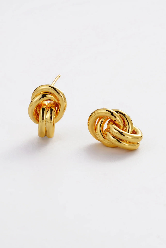 Clara earring - Gold-Zafino-The Clara Earring is a bold statement stud featuring an intricate woven knot design with a high-shine gold finish. Sculptural and eye-catching, this piece brings texture and dimension to your look while maintaining a timeless, elevated feel. Perfect for both everyday styling and special occasions, Clara adds a confident, polished touch to any jewellery collection. Metal: 18K gold plated on brass baseDimensions: 18mm length + 11.5mm widthWaterproof: Designed for daily wear, includ
