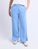Classic Track Pant - Blue-Foxwood-Comfort? Tick. Style? Double tick. Our Classic Track Pant is here to level up your lounge game. With an easy elastic waist, playful leg embroidery, and a straight-leg cut that feels as good as it looks—these pants are made for slow mornings and stylish strolls. Bonus points for the hem splits and pockets (because everything's better with pockets). Elastic waist Hem splits Leg embroidery 100% Cotton Our model is 176cm and wears Size 10-Pash + Evolve