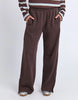 Classic Track Pant - Coffee-Foxwood-Comfort? Tick. Style? Double tick. Our Classic Track Pant is here to level up your lounge game. With an easy elastic waist, playful leg embroidery, and a straight-leg cut that feels as good as it looks—these pants are made for slow mornings and stylish strolls. Bonus points for the hem splits and pockets (because everything's better with pockets). Elastic waist Hem splits Leg embroidery 100% Cotton Our model is 176cm and wears Size 10-Pash + Evolve