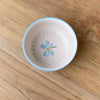 Condiment bowl - Junes garden forget me not-Robert gordon-Inspired by the lush garden of June Dyson—beloved grandmother and matriarch of the Gordon family—this collection is a tribute to time spent exploring her garden in the Gembrook hills. Delicate floral motifs adorn cake plates, side plates, and small bowls, each designed to mix and match with ease. Hand Painted Design 16 x 14 cm Made from high fired stoneware Microwave and Dishwasher safe Designed in Australia, Made in China-Pash + Evolve