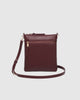 Cressida crossbody bag - bergundy-Louenhide-The Louenhide Cressida Burgundy Crossbody Bag is your go-to for everyday ease and streamlined functionality. Designed in rich, seasonal hues, this burgundy crossbody handbag is both timeless and practical. The structured silhouette offers a spacious interior to keep your daily essentials organised, while the secure zip closures ensure everything stays in place. Whether worn over the shoulder or across the body, the adjustable strap lets you tailor the fit to suit 