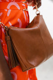 Daisy Crossbody Bag - Tan-Louenhide-The Louenhide Daisy Tan Crossbody Bag is a gorgeously soft and slouchy bag; it's a best-selling style for a reason! Full of functionality, secure your essentials in two slip pockets, one zip pocket, and a backside zip pocket. Complete with a fun tassel, the Daisy Tan is a relaxed and understated style that will be a staple for seasons to come. If the Daisy Tan Crossbody Bag is too big for you, feel free to shop the smaller version - The Kasey Crossbody Bag. Internal Featu