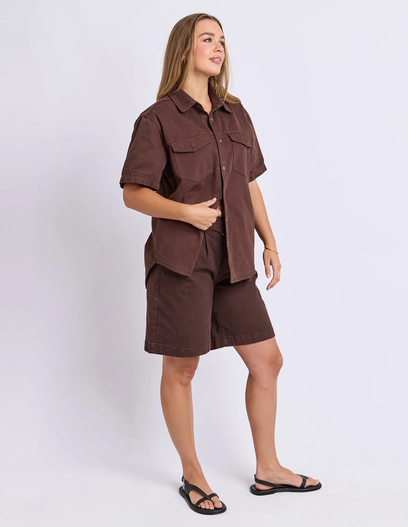 Daisy Short Sleeve Shirt - Chocolate-Foxwood-Your favourite denim shirt just got cooler with short sleeves. Featuring a button-through placket, front chest pockets, and a relaxed fit, the Daisy SS Shirt is perfect for easygoing days with laid-back style. Button through placket Front chest pockets Relaxed fit Model is wearing a size 10-Pash + Evolve