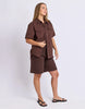 Daisy Short Sleeve Shirt - Chocolate-Foxwood-Your favourite denim shirt just got cooler with short sleeves. Featuring a button-through placket, front chest pockets, and a relaxed fit, the Daisy SS Shirt is perfect for easygoing days with laid-back style. Button through placket Front chest pockets Relaxed fit Model is wearing a size 10-Pash + Evolve